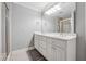 Elegant bathroom features dual sinks, a large mirror, and a tiled shower, combining style and functionality at 1236 Brickton Nw Dr, Atlanta, GA 30318