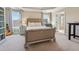 Comfortable bedroom offering ample natural light, stylish decor, and ensuite bathroom at 1236 Brickton Nw Dr, Atlanta, GA 30318