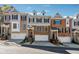 Attractive townhome exterior with brick and stone accents, and well-maintained landscaping at 1236 Brickton Nw Dr, Atlanta, GA 30318