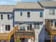Back of Townhome featuring multiple decks for enjoying private outdoor living spaces at 1236 Brickton Nw Dr, Atlanta, GA 30318