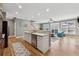 Bright, open-concept kitchen with a breakfast bar, modern appliances, and seamless flow to living area at 1236 Brickton Nw Dr, Atlanta, GA 30318