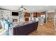 Open living room featuring hardwood floors, fireplace, built-in shelving, and open access to the kitchen at 1236 Brickton Nw Dr, Atlanta, GA 30318