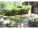 Fenced backyard with stone pathway and grassy area at 1457 Stoneleigh Cir, Stone Mountain, GA 30088