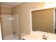 Well-lit bathroom with tub shower combination, light walls, and large mirror at 1457 Stoneleigh Cir, Stone Mountain, GA 30088
