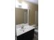 Bathroom with white sink and dark cabinetry at 1457 Stoneleigh Cir, Stone Mountain, GA 30088