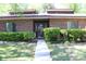 Charming brick home featuring manicured shrubbery and a well-maintained front yard, creating excellent curb appeal at 1457 Stoneleigh Cir, Stone Mountain, GA 30088