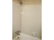 Shower with light ceramic tile and shower head at 1457 Stoneleigh Cir, Stone Mountain, GA 30088