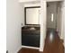 Convenient wet bar featuring a dark wood vanity, sink, mirror, and storage space at 1457 Stoneleigh Cir, Stone Mountain, GA 30088