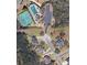 Overhead view of neighborhood including tennis court, pool, clubhouse, parking lot, and various homesites at 1827 Shaker Falls Ln, Lawrenceville, GA 30045