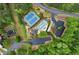 Aerial view showcasing community amenities including tennis courts and a pool at 1827 Shaker Falls Ln, Lawrenceville, GA 30045