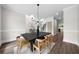 Spacious dining room with modern light fixture at 1827 Shaker Falls Ln, Lawrenceville, GA 30045