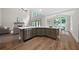 Kitchen view featuring a large island, stainless steel appliances, and hardwood floors at 1827 Shaker Falls Ln, Lawrenceville, GA 30045