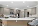 Modern kitchen featuring a large island, stainless steel appliances, and stylish cabinetry at 1827 Shaker Falls Ln, Lawrenceville, GA 30045