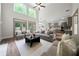 Bright, open living room with high ceilings and modern finishes flowing into the kitchen at 1827 Shaker Falls Ln, Lawrenceville, GA 30045
