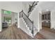 Beautiful staircase with wrought iron railings and hardwood steps leading to the upper level at 1827 Shaker Falls Ln, Lawrenceville, GA 30045