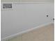 Laundry room detail highlighting white wainscotting and tile flooring at 1827 Shaker Falls Ln, Lawrenceville, GA 30045