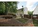 A lush backyard includes fencing, mature trees, patio, and a well-maintained lawn at 2980 Porsche Nw Pl, Kennesaw, GA 30144