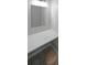 Bathroom vanity features a built-in marble countertop and a modern mirror at 2980 Porsche Nw Pl, Kennesaw, GA 30144