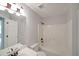 Bathroom features double sinks, white shower-tub, and gray walls in neutral decor at 2980 Porsche Nw Pl, Kennesaw, GA 30144
