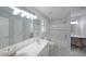 Well-lit bathroom featuring a double vanity, tub-shower combo and a built-in vanity at 2980 Porsche Nw Pl, Kennesaw, GA 30144