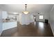 Open-concept living room features hardwood flooring and seamless flow into the kitchen at 2980 Porsche Nw Pl, Kennesaw, GA 30144