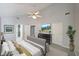 Spacious main bedroom featuring stylish furniture, decor and natural light from doors and windows at 2980 Porsche Nw Pl, Kennesaw, GA 30144