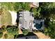 Aerial view of a home showcasing the roof, driveway, pool, and landscaping at 3003 W Roxboro Rd, Atlanta, GA 30324