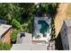 Aerial view of backyard featuring pool and patio perfect for lounging and entertaining at 3003 W Roxboro Rd, Atlanta, GA 30324