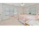 Bedroom featuring neutral carpeting, white trim and two sunny windows at 3003 W Roxboro Rd, Atlanta, GA 30324