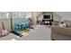 Bonus room with natural light, carpeted floors and space for a playroom at 3003 W Roxboro Rd, Atlanta, GA 30324