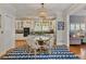 Inviting breakfast area featuring a beaded chandelier and nearby kitchen access at 3003 W Roxboro Rd, Atlanta, GA 30324