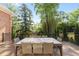 Expansive wooden deck with outdoor seating, perfect for entertaining and enjoying the wooded views at 3003 W Roxboro Rd, Atlanta, GA 30324