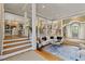 Bright living room with hardwood floors, white pillars, and a decorative rug at 3003 W Roxboro Rd, Atlanta, GA 30324