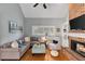 Inviting living room featuring a brick fireplace, plush seating, and abundant natural light at 3003 W Roxboro Rd, Atlanta, GA 30324