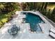 Backyard in-ground pool with a lounge area and mature landscaping at 3003 W Roxboro Rd, Atlanta, GA 30324