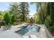 Enjoy the outdoors in this in-ground pool with stone trim and surrounding patio at 3003 W Roxboro Rd, Atlanta, GA 30324
