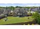 Expansive backyard featuring a fire pit area, lush lawn, and privacy fence, ideal for outdoor activities and relaxation at 5950 Hidden Ridge Ct, Cumming, GA 30028