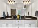 Elegant bathroom featuring double sinks and luxurious finishes, creating a spa-like experience at 5950 Hidden Ridge Ct, Cumming, GA 30028
