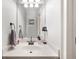 Neat bathroom with a pristine white countertop and modern fixtures, providing a clean and simple space at 5950 Hidden Ridge Ct, Cumming, GA 30028