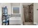 Bathroom featuring a shower and a bathtub next to a window at 5950 Hidden Ridge Ct, Cumming, GA 30028