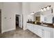 Bathroom with tile flooring, double sinks, and granite countertops at 5950 Hidden Ridge Ct, Cumming, GA 30028