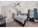 Spacious bedroom featuring a vaulted ceiling and abundant natural light, creating a serene retreat at 5950 Hidden Ridge Ct, Cumming, GA 30028