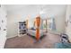 Bright bedroom with canopy bed, bookcase, and a great source of natural light at 5950 Hidden Ridge Ct, Cumming, GA 30028