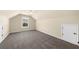 Bonus room with neutral walls and a view of the surrounding neighborhood at 5950 Hidden Ridge Ct, Cumming, GA 30028
