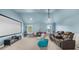 Spacious bonus room with a projector, movie screen, and tiered seating at 5950 Hidden Ridge Ct, Cumming, GA 30028