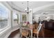 Cozy breakfast nook with natural light, dining table, and views to the backyard and living room at 5950 Hidden Ridge Ct, Cumming, GA 30028