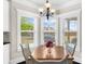 Bright breakfast nook with large windows, creating a cozy spot for morning meals at 5950 Hidden Ridge Ct, Cumming, GA 30028