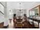 Traditional dining room with wood floors, large window, and decorative accents at 5950 Hidden Ridge Ct, Cumming, GA 30028