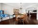 Dining room featuring an adjacent game area with a pinball machine at 5950 Hidden Ridge Ct, Cumming, GA 30028