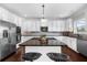 Kitchen with white cabinets, granite countertops, stainless steel appliances and a center island at 5950 Hidden Ridge Ct, Cumming, GA 30028